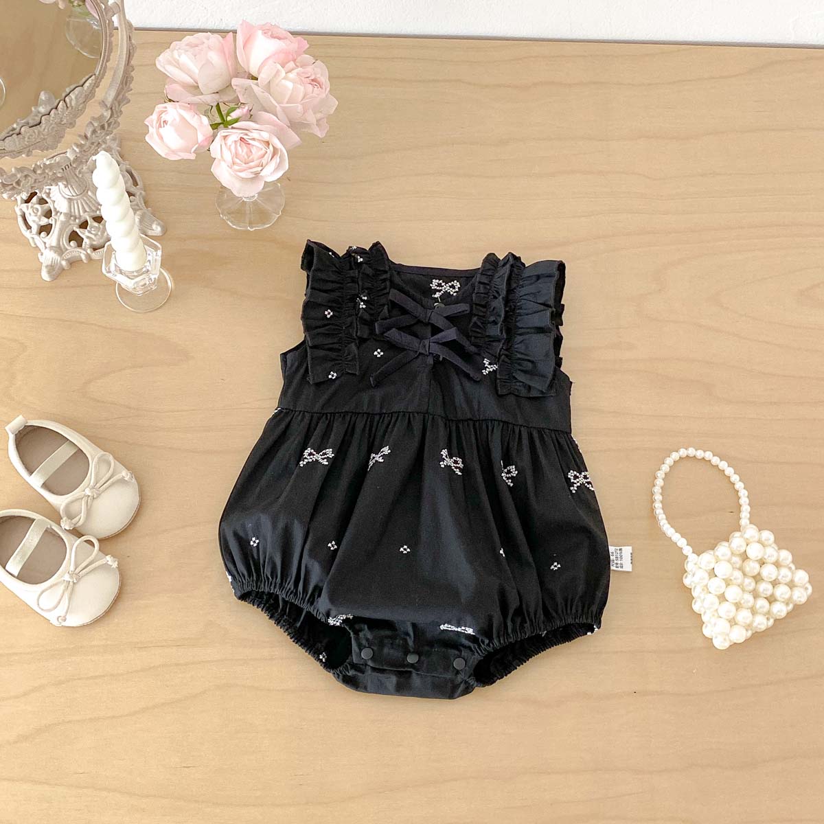 Zwarte romper met strikprint v - Baby Nursery Accessories recensie en prijs